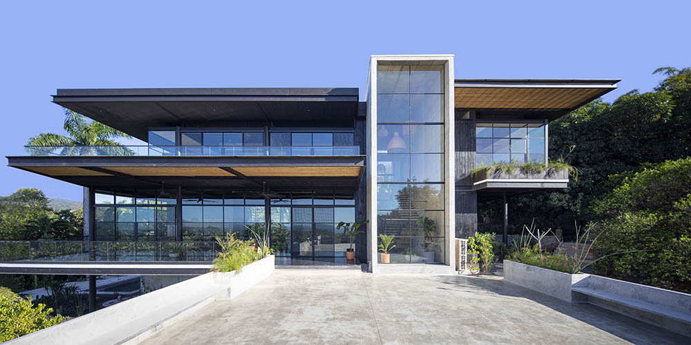 Studio Saxe designs a family home, called Tres Amores House, perched on the hilltops of the town of Nosara, Costa Rica