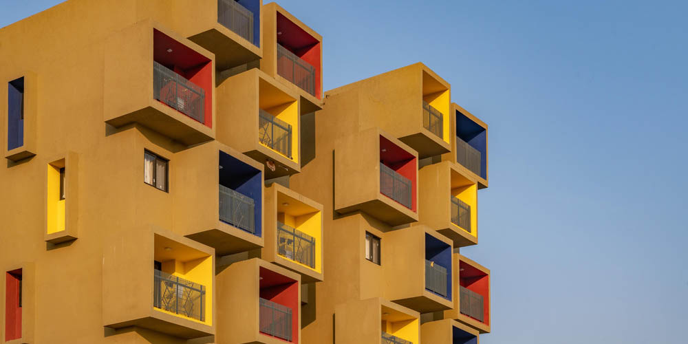 Sanjay Puri Architects designed a composition of coloured cuboids that defines this sculptural residential project named Studios 90.